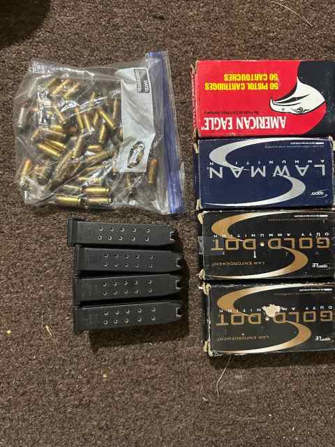 .40 cal ammo and Glock 23 mags and holster 