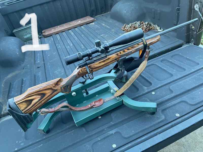 Four loaded out rifles 